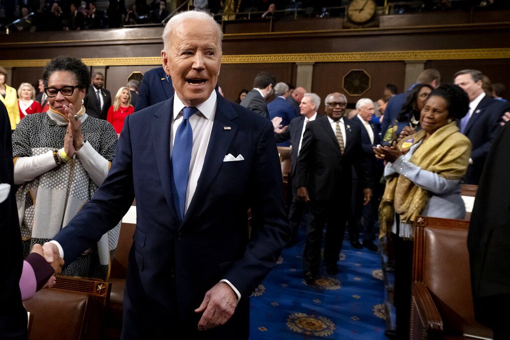 President Joe Biden delivers his first State of the Union address to a joint session of Congress at the Capitol, Tuesday, March 1, 2022, in Washington, as House speaker Nancy Pelosi of Calif., looks at a copy of Biden's speech at left.