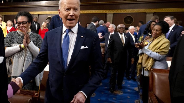 President Joe Biden delivers his first State of the Union address to a joint session of Congress at the Capitol, Tuesday, March 1, 2022, in Washington, as House speaker Nancy Pelosi of Calif., looks at a copy of Bidens speech at left.