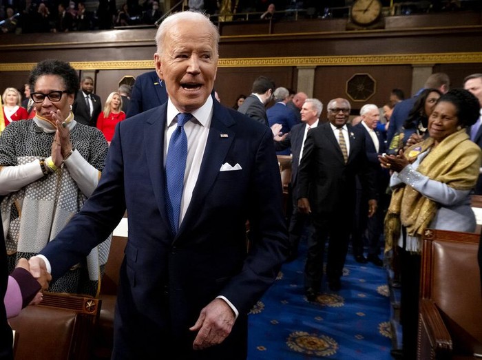 President Joe Biden delivers his first State of the Union address to a joint session of Congress at the Capitol, Tuesday, March 1, 2022, in Washington, as House speaker Nancy Pelosi of Calif., looks at a copy of Bidens speech at left.