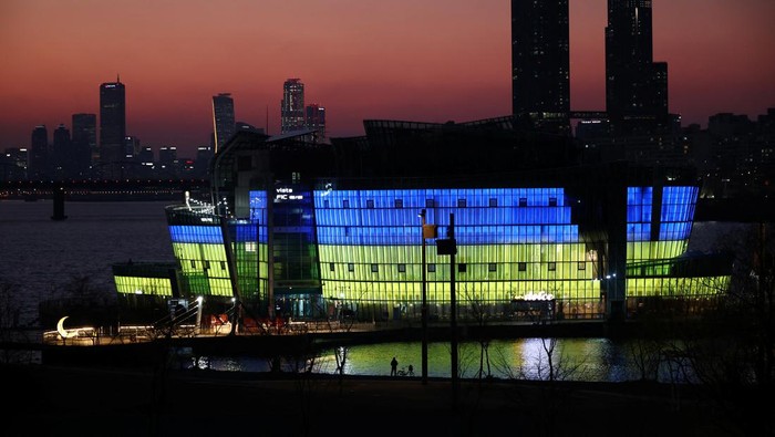 The Sevit floating island is lit in the colour of Ukraine national flag in support of Ukrainians following Russia's invasion against Ukraine, in Seoul, South Korea, March 2, 2022. REUTERS/Kim Hong-Ji