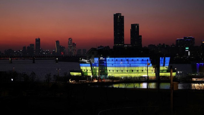 The Sevit floating island is lit in the colour of Ukraine national flag in support of Ukrainians following Russia's invasion against Ukraine, in Seoul, South Korea, March 2, 2022. REUTERS/Kim Hong-Ji