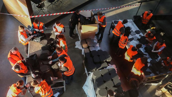 Volunteers assemble flak jackets in a warehouse as a part of a shipment to Ukraine, following Russia's invasion of Ukraine, in Prague, Czech Republic, March 2, 2022. Picture taken March 2, 2022. REUTERS/Eva Korinkova