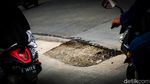 Awas! Jalan Beton Dekat Tol Brigif Depok Berlubang
