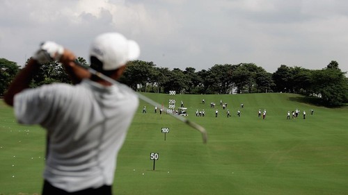 JAKARTA, INDONESIA - MARCH 23:  The local club caddy?s pick up the balls on the driving range during the Pro-Am of the Indonesia Open 2005 at the Cengkareng Golf Club on March 23, 2005 in Jakarta , Indonesia.  (Photo by Ian Walton/Getty Images)