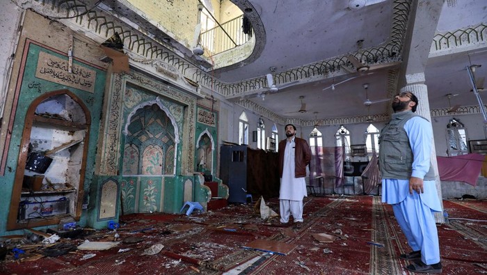 A man walks amid the damages at the prayer hall after a bomb blast inside a mosque during Friday prayers in Peshawar, Pakistan, March 4, 2022. REUTERS/Fayaz Aziz