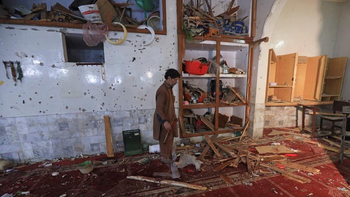 A man walks amid the damages at the prayer hall after a bomb blast inside a mosque during Friday prayers in Peshawar, Pakistan, March 4, 2022. REUTERS/Fayaz Aziz