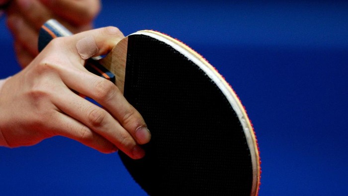 DOHA, QATAR - NOVEMBER 29: A Chinese player grips the racquet during the Womens Team round one at 15th Asian Games Doha 2006 at Al-Arabi Indoor Hall November 29, 2006 in Doha, Qatar. (Photo by Christof Koepsel/Getty Images for DAGOC)