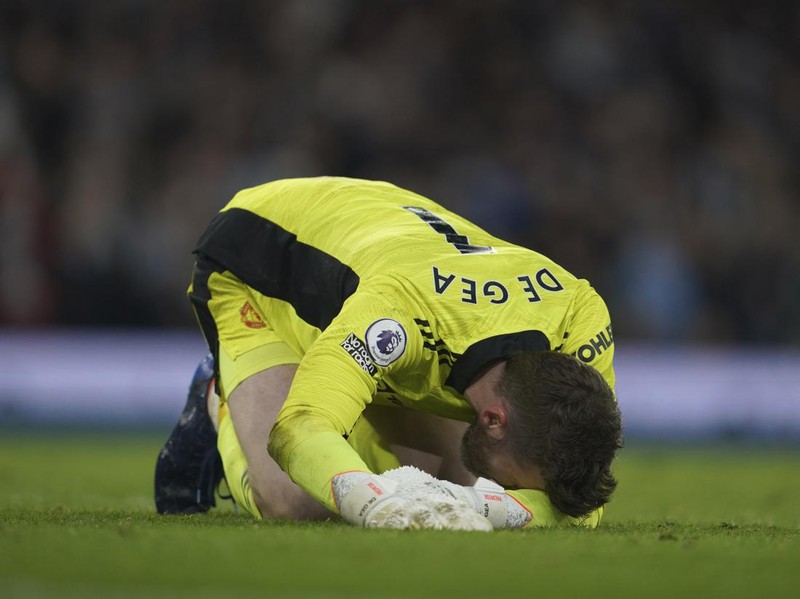 Manchester United's goalkeeper David de Gea gestures after Manchester City's Riyad Mahrez scores his side's fourth goal during the English Premier League soccer match between Manchester City and Manchester United, at the Etihad stadium in Manchester, England, Sunday, March 6, 2022. (AP Photo/Jon Super)
