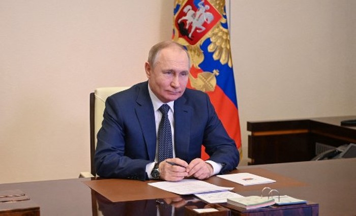 Russian President Vladimir Putin attends a flag raising ceremony on the ferry Marshal Rokossovsky via a video link at the Novo-Ogaryovo state residence outside Moscow on March 4, 2022. (Photo by Alexey NIKOLSKY / SPUTNIK / AFP)