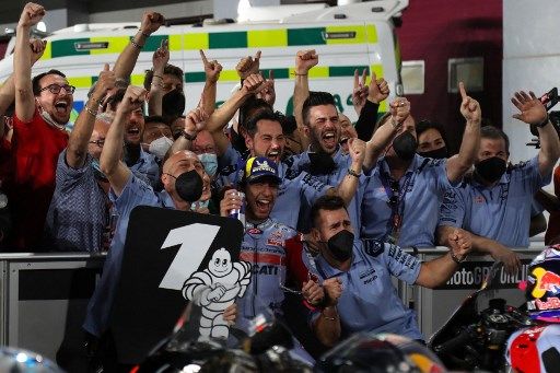 Gresini Racing MotoGP team's Italian rider Enea Bastianini celebrates winning the Moto GP Grand Prix of Qatar at the Lusail International Circuit, in the city of Lusail on March 6, 2022. (Photo by KARIM JAAFAR / AFP)