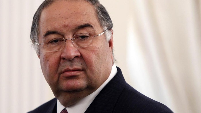 FILE - In this Thursday, Sept. 12, 2013 file photo, Uzbek-born Russian businessman Alisher Usmanov attends a meeting of Russian President Vladimir Putin and Crown Prince Sheik Mohammed bin Zayed Al Nahyan of the United Arab Emirates at the Novo-Ogaryovo state residence outside Moscow. Born in what is now Uzbekistan, Usmanov has interests in metals and mining as well as some of Russia's biggest telecoms and internet businesses. (Maxim Shemetov/Pool Photo via AP, File)