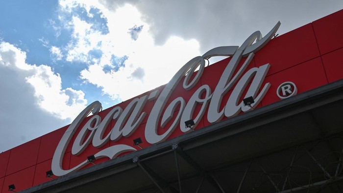 A view shows a traffic sign Stop and a board with the logo of Coca-Cola at the companys plant in Azov in the Rostov region, Russia March 9, 2022. REUTERS/Sergey Pivovarov