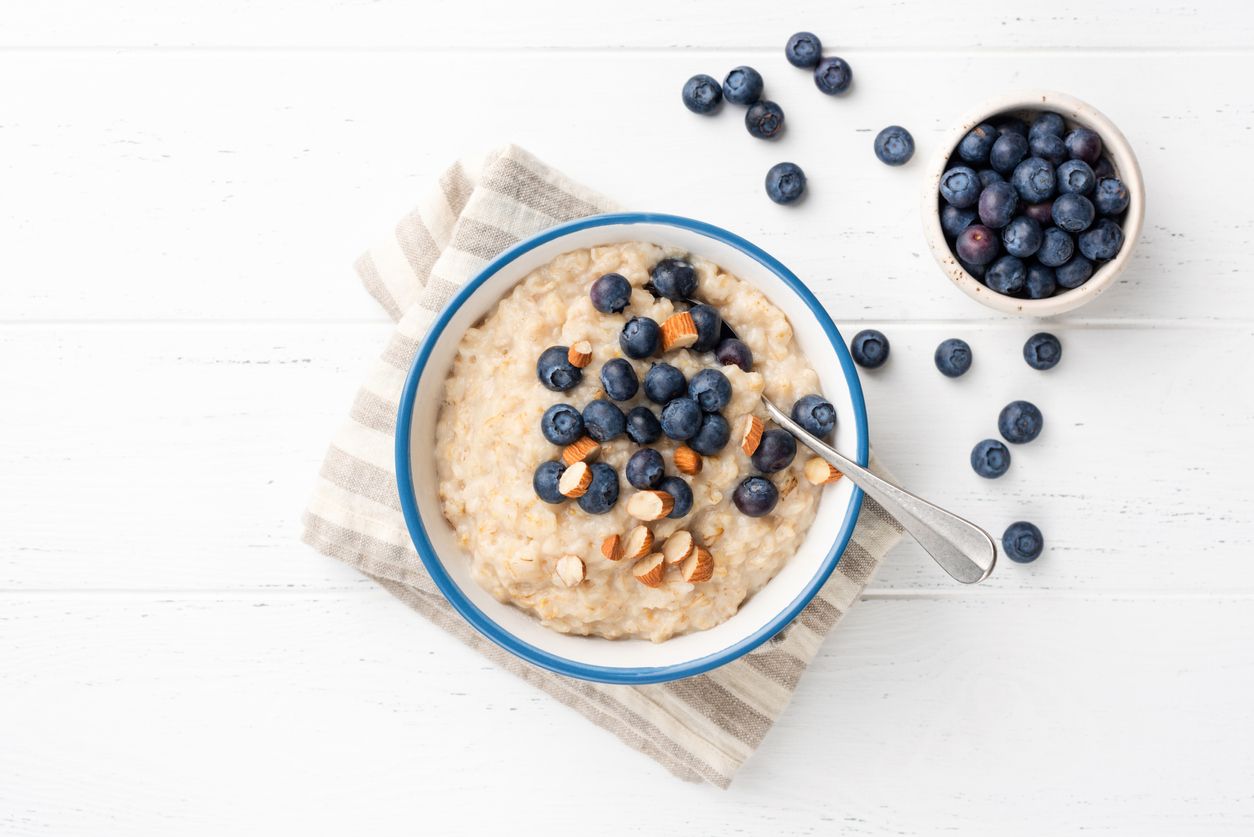 Oatmeal Porridge With Blueberries, Almonds In Bowl. Top View Copy Space For Text. Healthy Eating, Healthy Lifestyle, Eating Good Food Concept