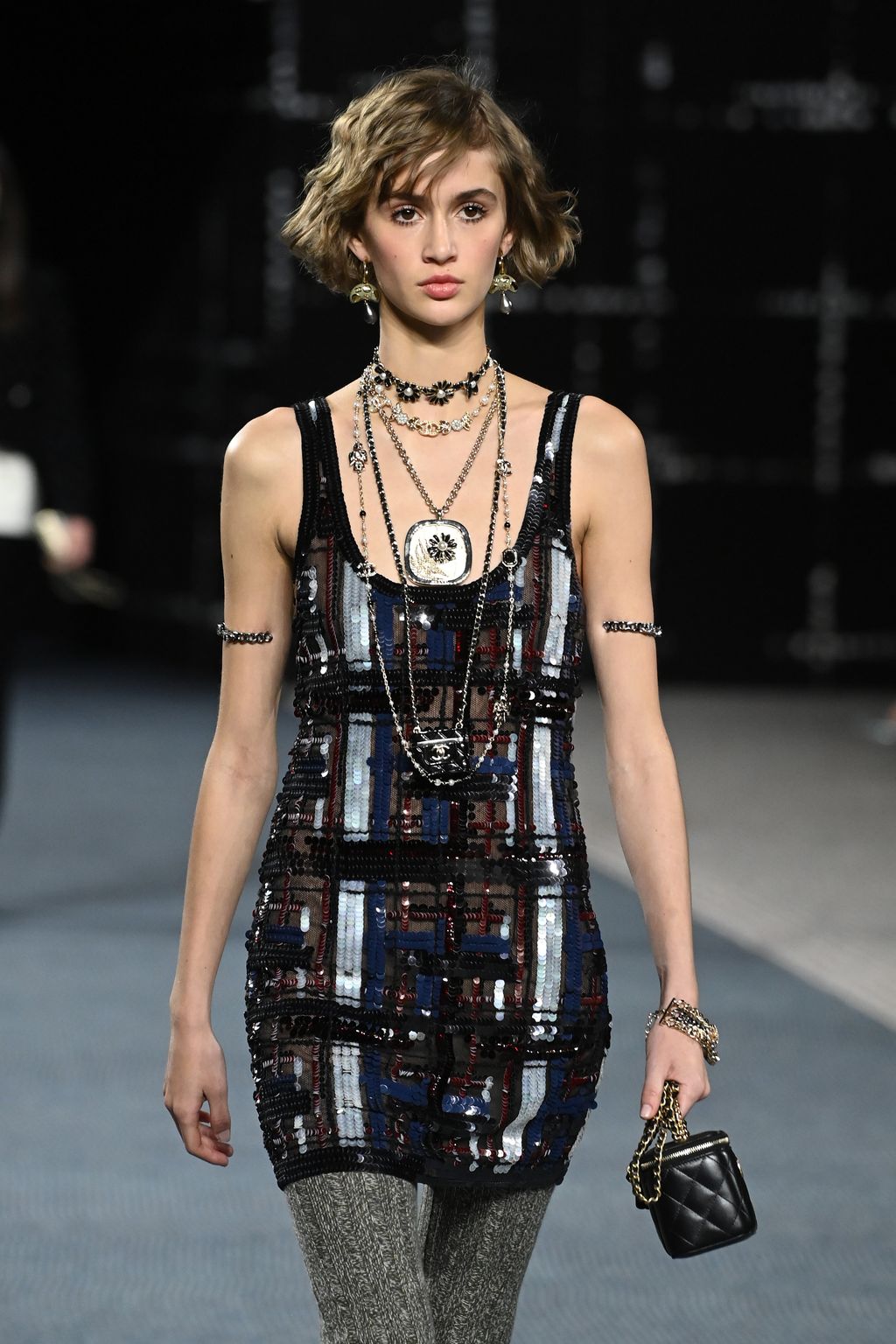 PARIS, FRANCE - MARCH 08: (EDITORIAL USE ONLY - For Non-Editorial use please seek approval from Fashion House) Models walk the runway during the Chanel Womenswear Fall/Winter 2022-2023 show as part of Paris Fashion Week on March 08, 2022 in Paris, France. (Photo by Pascal Le Segretain/Getty Images)