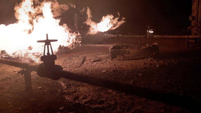 Facilities of a complex that prepares natural gas for transportation are pictured in a fire after night shelling, as Russia's attack on Ukraine continues, in the village of Hlazunivka in Kharkiv region, Ukraine, in this handout picture released March 13, 2022. Press service of the State Emergency Service of Ukraine/Handout via REUTERS ATTENTION EDITORS - THIS IMAGE HAS BEEN SUPPLIED BY A THIRD PARTY. MANDATORY CREDIT.