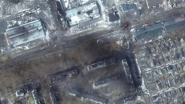 A satellite image shows a multispectral view of craters in a field and damaged buildings, in the Zhovtneyvi district, in the western section of Mariupol, Ukraine March 12, 2022. Satellite image ©2022 Maxar Technologies/Handout via REUTERS ATTENTION EDITORS - THIS IMAGE HAS BEEN SUPPLIED BY A THIRD PARTY. MANDATORY CREDIT. NO RESALES. NO ARCHIVES. DO NOT OBSCURE LOGO.