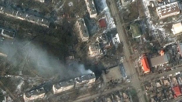 A satellite image shows a multispectral view of craters in a field and damaged buildings, in the Zhovtneyvi district, in the western section of Mariupol, Ukraine March 12, 2022. Satellite image ©2022 Maxar Technologies/Handout via REUTERS ATTENTION EDITORS - THIS IMAGE HAS BEEN SUPPLIED BY A THIRD PARTY. MANDATORY CREDIT. NO RESALES. NO ARCHIVES. DO NOT OBSCURE LOGO.