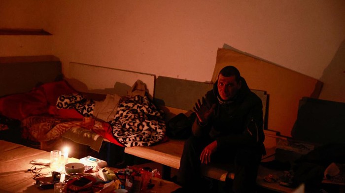 A man sits in a bomb shelter, amid Russia's invasion of Ukraine, in Irpin, Ukraine, March 12, 2022. REUTERS/Serhii Nuzhnenko