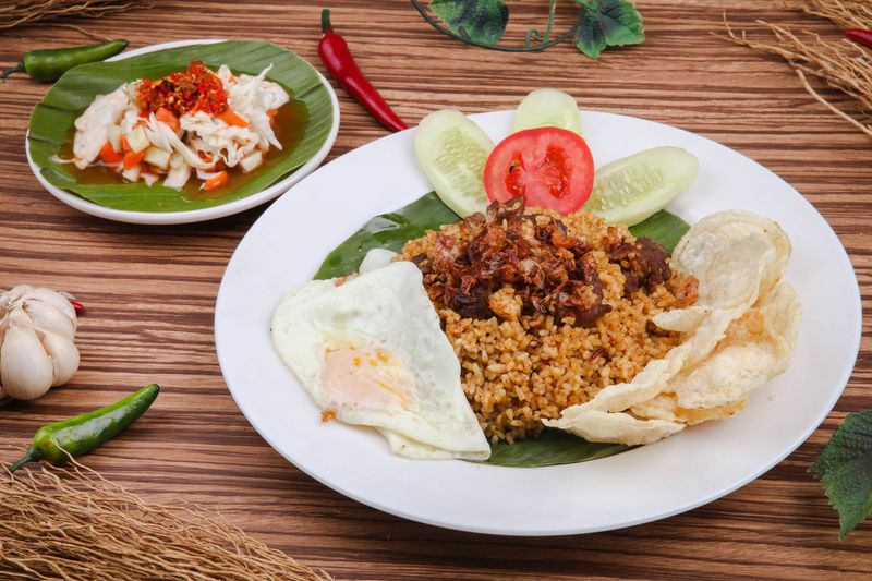 Nasi Goreng Kambing or Goat Fried Rice is a traditional food from Indonesia, Fried rice with goat meat and egg