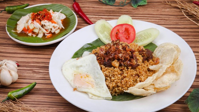 Nasi Goreng Kambing or Goat Fried Rice is a traditional food from Indonesia, Fried rice with goat meat and egg