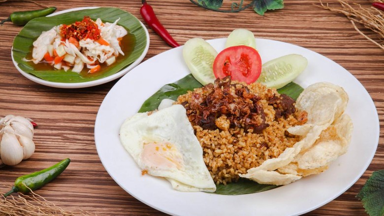 nasi goreng kambing Nasi Goreng Kambing or Goat Fried Rice is a traditional food from Indonesia, Fried rice with goat meat and egg