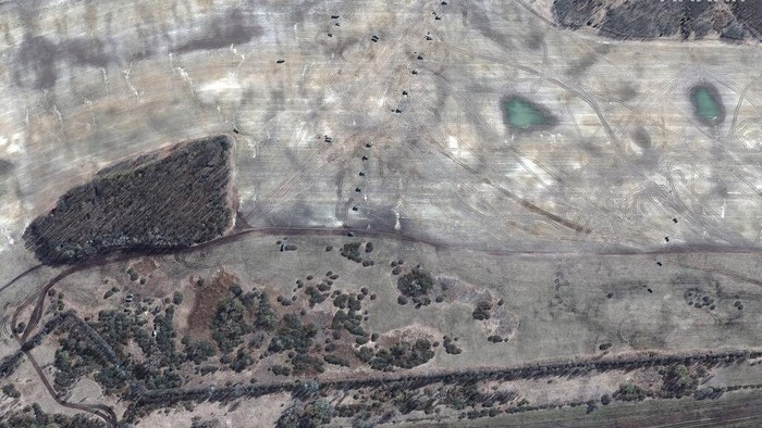This satellite image provided by Maxar Technologies shows an overview of a large deployment of attack and troop transport helicopters at VD Bolshoy Bokov airfield, in southern Belarus, Monday, March 14, 2022, during the Russian invasion of Ukraine. (Satellite image ©2022 Maxar Technologies via AP)