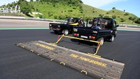 Petugas membersihkan lintasan Pertamina Mandalika International Street Circuit, di Lombok Tengah, NTB.