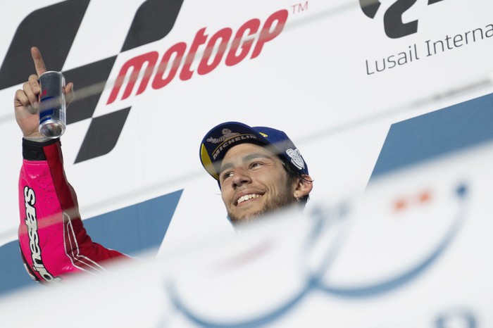 DOHA, QATAR - MARCH 06: Enea Bastianini of Italy and Gresini Racing MotoGP celebrates the victory on the podium during the MotoGP race during the MotoGP of Qatar - Race at Losail Circuit on March 06, 2022 in Doha, Qatar. (Photo by Mirco Lazzari gp/Getty Images,)