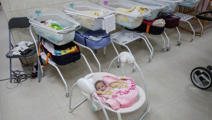 Surrogate-born babies are seen inside a special shelter owned by BioTexCom clinic in a residential basement, as Russia's invasion continues, on the outskirts of Kyiv, Ukraine March 15, 2022. Picture taken March 15, 2022. REUTERS/Gleb Garanich