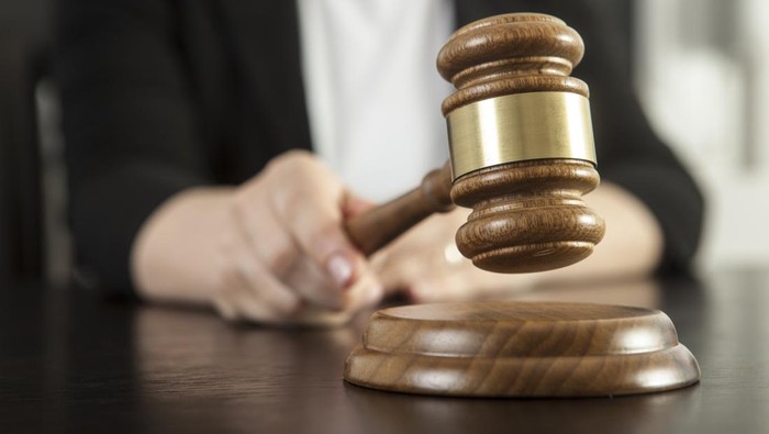 Caucasian woman holding gavel