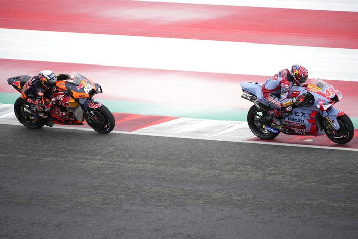 Italian rider Fabio Di Giannantonio of Gresini Racing MotoGP, right, and Portuguese rider Miguel Aliveira of Red Bull KTM Factory Racing pass by during third free practice at Pertamina Mandalika Circuit in Mandalika, Lombok Island, Indonesia, Saturday, March 19, 2022.(AP Photo/Achmad Ibrahim)