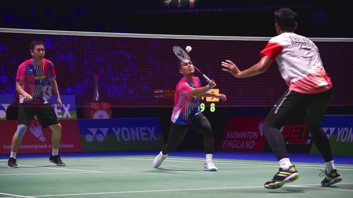 Indonesia's Muhammad Shohibul Fikri, left, and Bagas Maulana celebrate after defeating their compatriots Mohammad Ahsan and Hendra Setiawan during their men's doubles final match at the All England Open Badminton Championships in Birmingham, England, Sunday, March 20, 2022. (AP Photo/Rui Vieira)