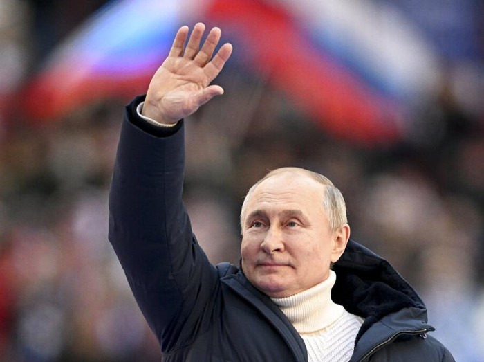 Russian President Vladimir Putin greets people after his speech at the concert marking the eighth anniversary of the referendum on the state status of Crimea and Sevastopol and its reunification with Russia, in Moscow, Russia, Friday, March 18, 2022. (Ramil Sitdikov/Sputnik Pool Photo via AP)