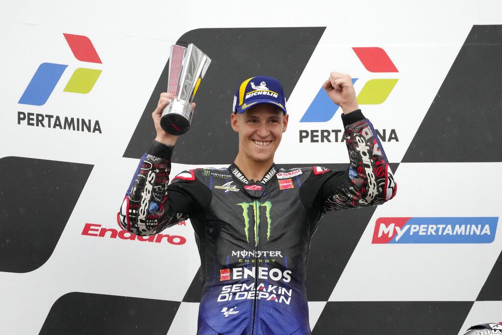 Second placed Fabio Quartararo of France celebrates during the awarding ceremony during Moto GP the Pertamina Grand Prix of Indonesia motorcycle racing at the Pertamina Mandalika Circuit in Mandalika, Lombok Island, Indonesia, Sunday, March 20, 2022.(AP Photo/Achmad Ibrahim)