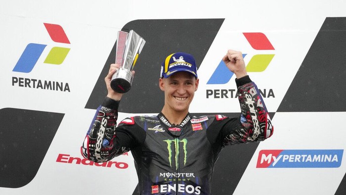 Second placed Fabio Quartararo of France celebrates during the awarding ceremony during Moto GP the Pertamina Grand Prix of Indonesia motorcycle racing at the Pertamina Mandalika Circuit in Mandalika, Lombok Island, Indonesia, Sunday, March 20, 2022.(AP Photo/Achmad Ibrahim)
