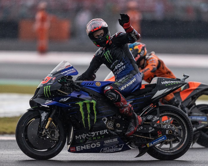 LOMBOK, INDONESIA - MARCH 20: MotoGP rider Fabio Quartararo #20 of France and Monster Energy Yamaha MotoGP™ waves to the spectators during the MotoGP Grand Prix of Indonesia at Mandalika International Street Circuit on March 20, 2022 in Lombok, Indonesia. (Photo by Robertus Pudyanto/Getty Images)