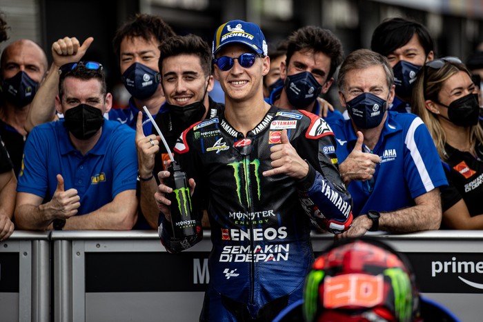 LOMBOK, INDONESIA - MARCH 19: MotoGP rider Fabio Quartararo #20 of France and Monster Energy Yamaha MotoGP™ celebrates pole position during the qualifying round of the MotoGP Grand Prix of Indonesia at Mandalika International Street Circuit on March 19, 2022 in Lombok, Indonesia. (Photo by Robertus Pudyanto/Getty Images)