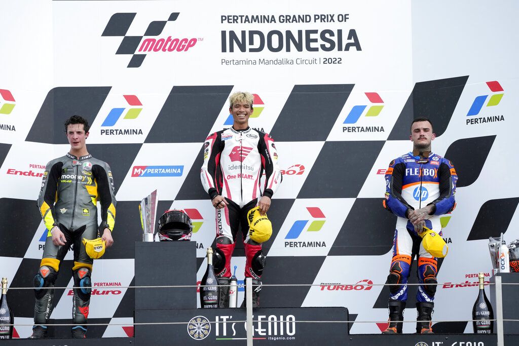 Thailand's rider Somkiat Chantra of IDEMITSU Honda team Asia celebrates victory after winning the Moto2 Pertamina Grand Prix of Indonesia at Pertamina Mandalika Circuit in Mandalika, Lombok Island, Indonesia, Sunday, March 20, 2022.(AP Photo/Achmad Ibrahim)