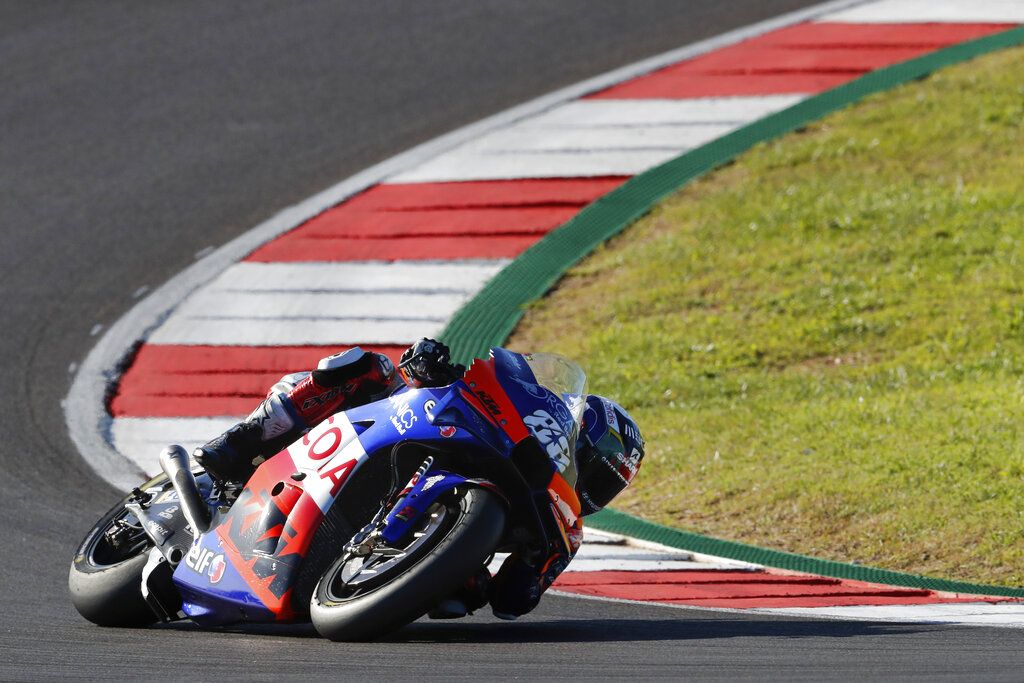 MotoGP rider Miguel Oliveira of Portugal steers his motorcycle during the MotoGP race of the Portuguese Motorcycle Grand Prix, the last race of the season, at the Algarve International circuit near Portimao, Portugal, Sunday, Nov. 22, 2020. (AP Photo/Armando Franca)
