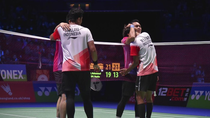 Indonesias Muhammad Shohibul Fikri, right, and Bagas Maulana are congratulated by their compatriots Mohammad Ahsan and Hendra Setiawan after defeating them during their mens doubles final match at the All England Open Badminton Championships in Birmingham, England, Sunday, March 20, 2022. (AP Photo/Rui Vieira)
