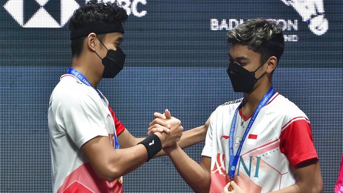 Indonesias Muhammad Shohibul Fikri, right, and Bagas Maulana celebrate with their gold medals following their victory over their compatriots Mohammad Ahsan and Hendra Setiawan in their mens doubles final match at the All England Open Badminton Championships in Birmingham, England, Sunday, March 20, 2022. (AP Photo/Rui Vieira)
