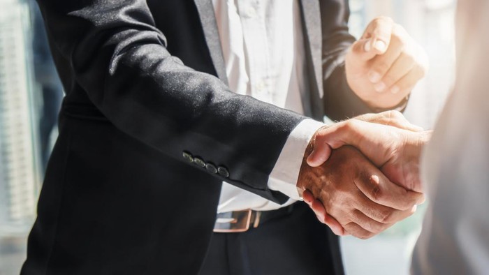 business background of businessman having handshake