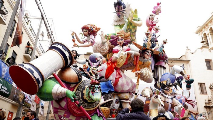 A falla burns during the traditional Fallas festival in Valencia, Spain, Saturday, March 19, 2022. Fallas are gigantic structures made of cardboard portraying current events and personalities in which individual figures or Ninots are placed. (AP Photo/Alberto Saiz)