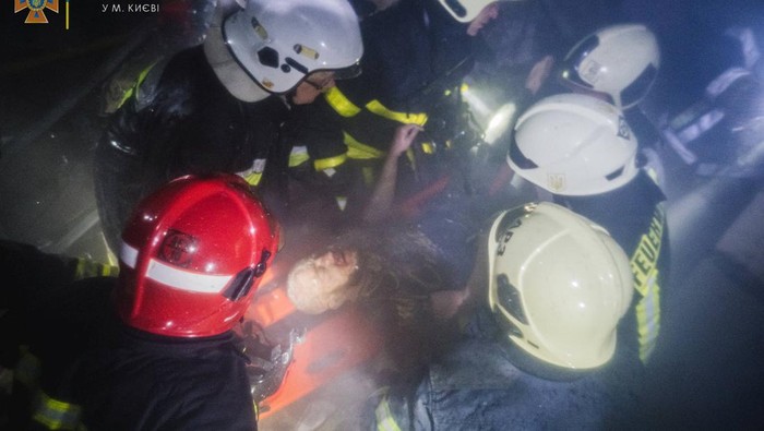 SENSITIVE MATERIAL. THIS IMAGE MAY OFFEND OR DISTURB Rescuers release a man from under the debris inside a shopping mall damaged by an airstrike, as Russia's attack on Ukraine continues, in Kyiv, Ukraine, in this handout picture released March 21, 2022. Press service of the State Emergency Service of Ukraine/Handout via REUTERS ATTENTION EDITORS - THIS IMAGE HAS BEEN SUPPLIED BY A THIRD PARTY.