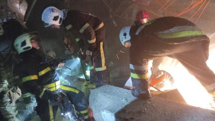 Firefighters search the debris of a shopping center following Russian shelling in Kyiv. (Ministry of Internal Affairs of Ukraine Press Service via AFP)