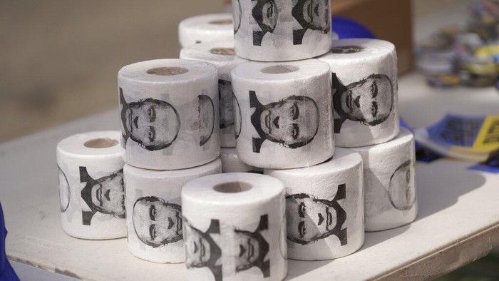 Rolls of toilet paper printed with the face of Russian President Vladimir Putin are sold at a rally in support of Ukraine in Los Angeles, on Saturday, March 19, 2022. (AP Photo/Damian Dovarganes)