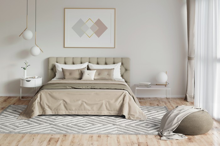 Ilustrasi kamar tidur 3d illustration. Cozy bedroom in warm colors with painting, a nightstand, a pouf, and a plaid. Front view