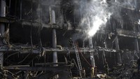Salah satu bangunan yang menjadi puing beton usai dihajar bom Rusia. (AP/Rodrigo Abd) 