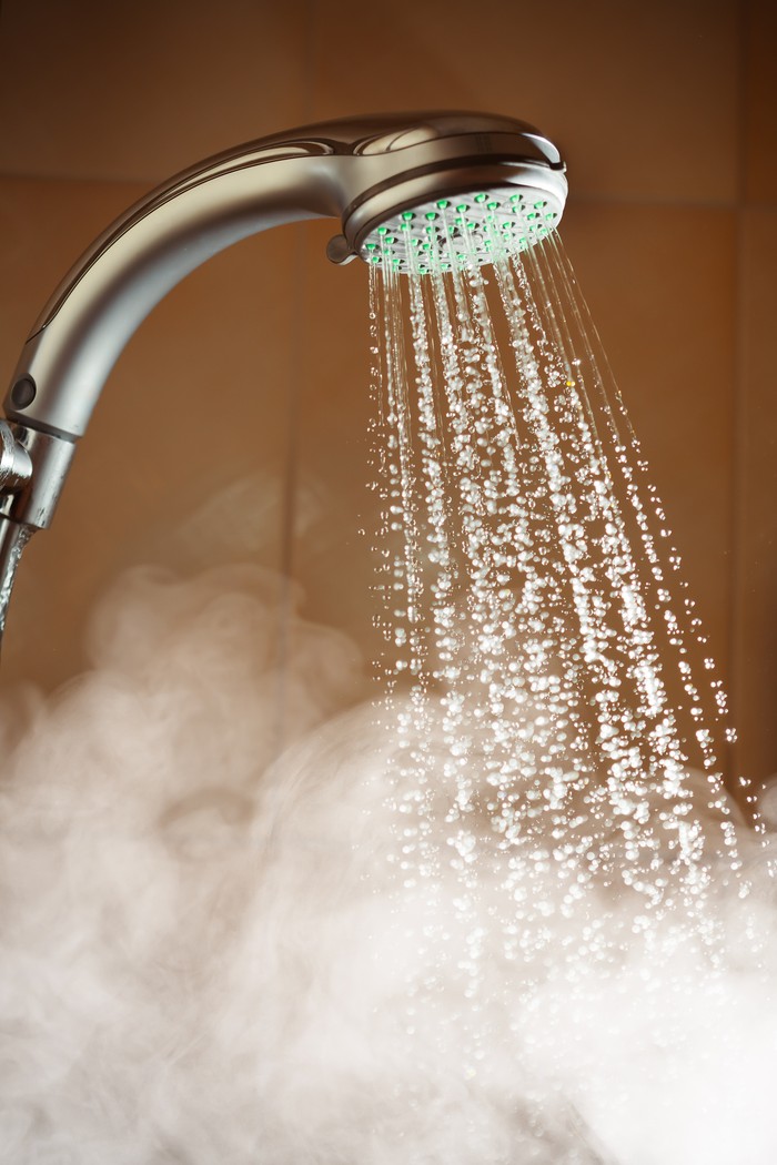 shower with flowing water and steam, closeup view