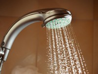 shower with flowing water and steam, closeup view